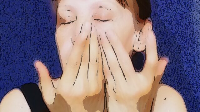 woman makes a zig zag shot of her face Self facial massage: a woman takes a zigzag shot of her face.